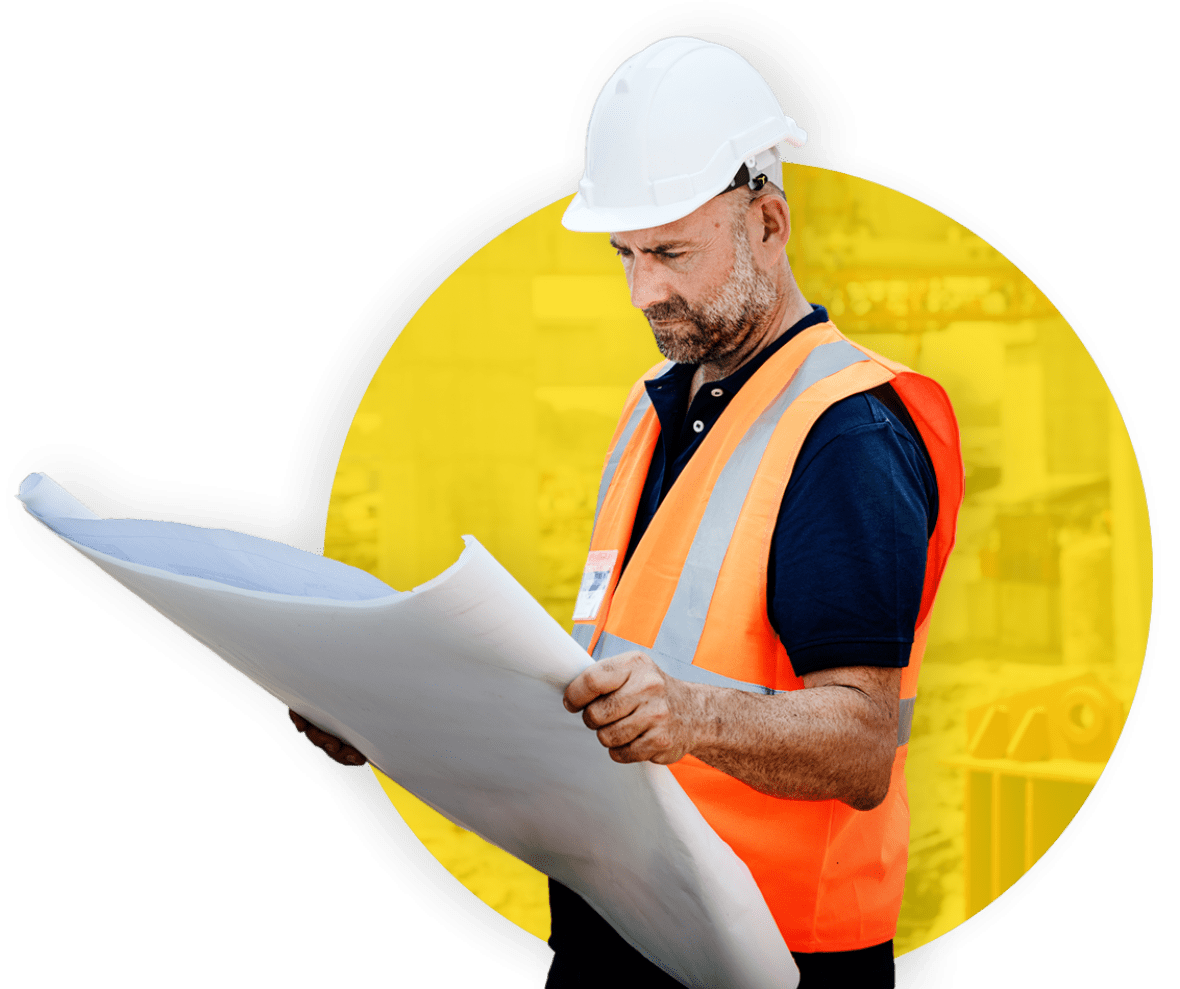 Construction estimator reviewing building plans and project documents