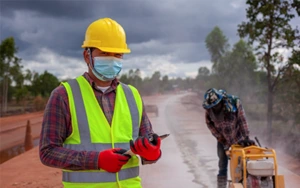 Construction worker performing concrete work for residential and commercial projects